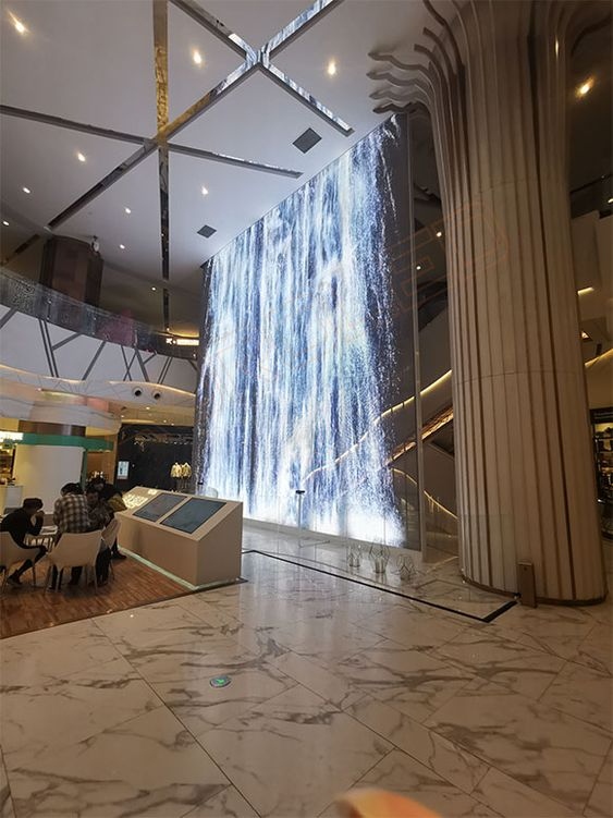 广州玻璃幕墙工厂，商场商业中心应用的光电玻璃幕墙如何把映画投放在玻璃上